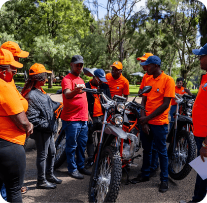people looking at the motorbike