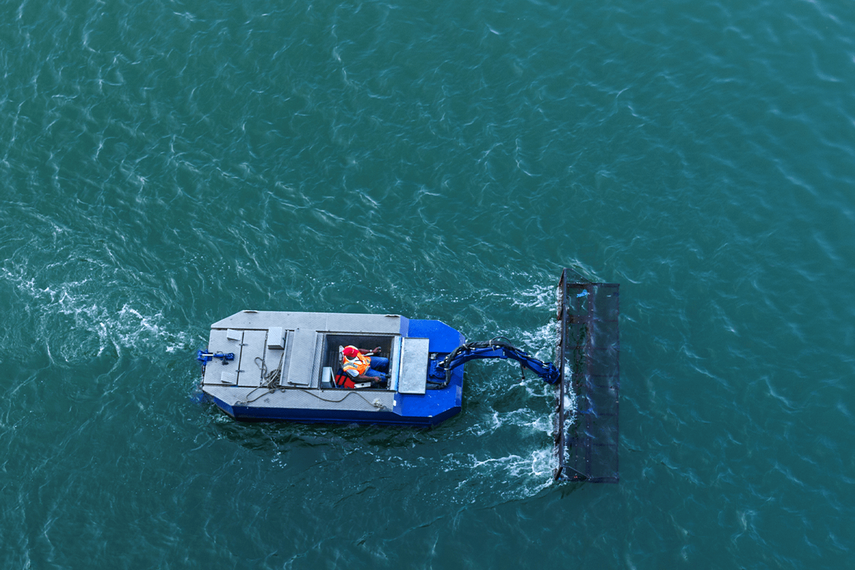 5 sustainable business practices_boat collecting waste_visual 3