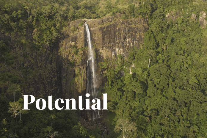 Africas $82 billion carbon credit potential_Aerial view of a large waterfall in the middle of a lush forest in Ghana_visual 1 (1)
