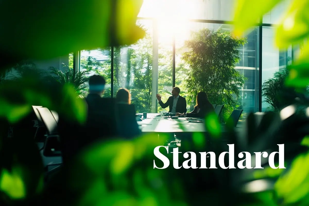 Carbon removal enters the spotlight in SBTi’s net-zero draft_An office scene framed by greenery, with employees during a meeting_visual 1