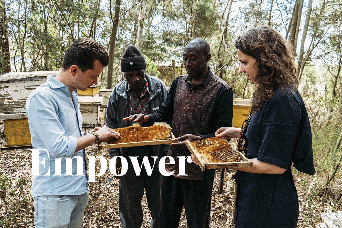 Corekees’ Project Beehive_ Corekees team and local farmers checking honeycombs in a beehouse in Kenya_visual 1