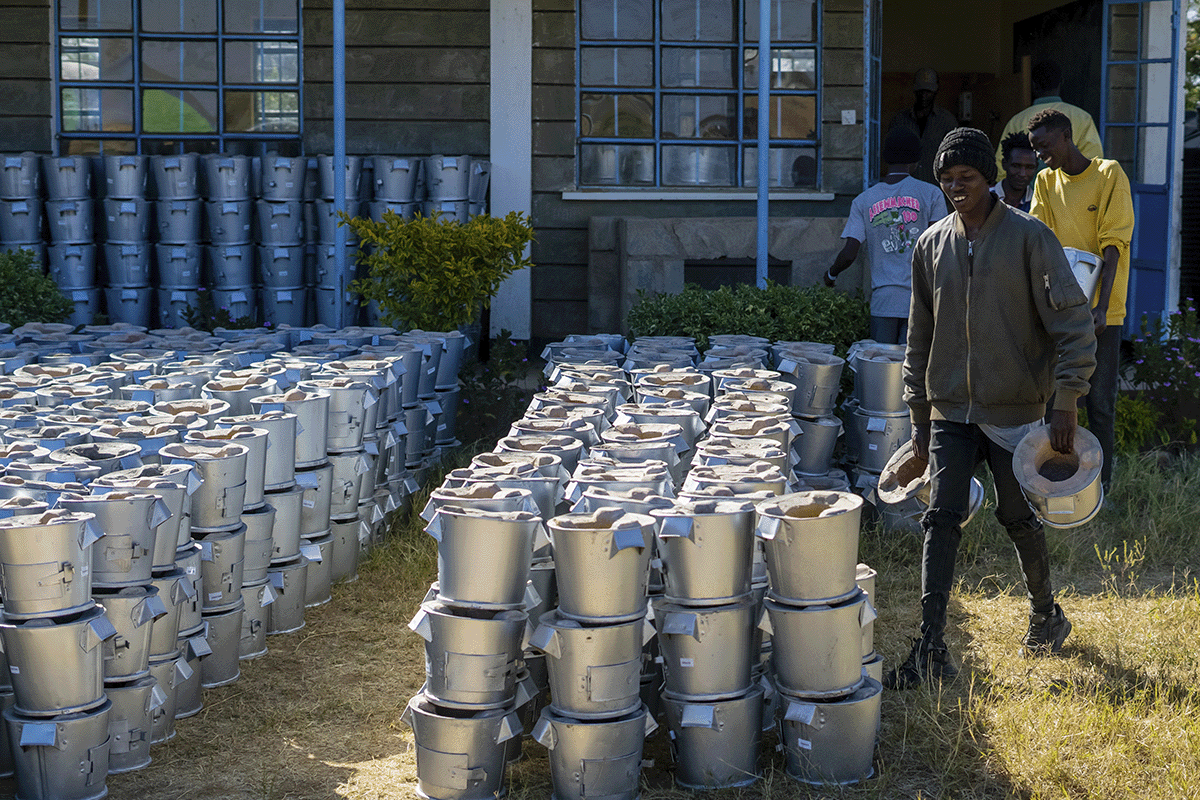 DGB’s Kenya cookstove project_ kicking off 2024 with sustainable impact_Local men arranging cookstoves in a row_visual 3