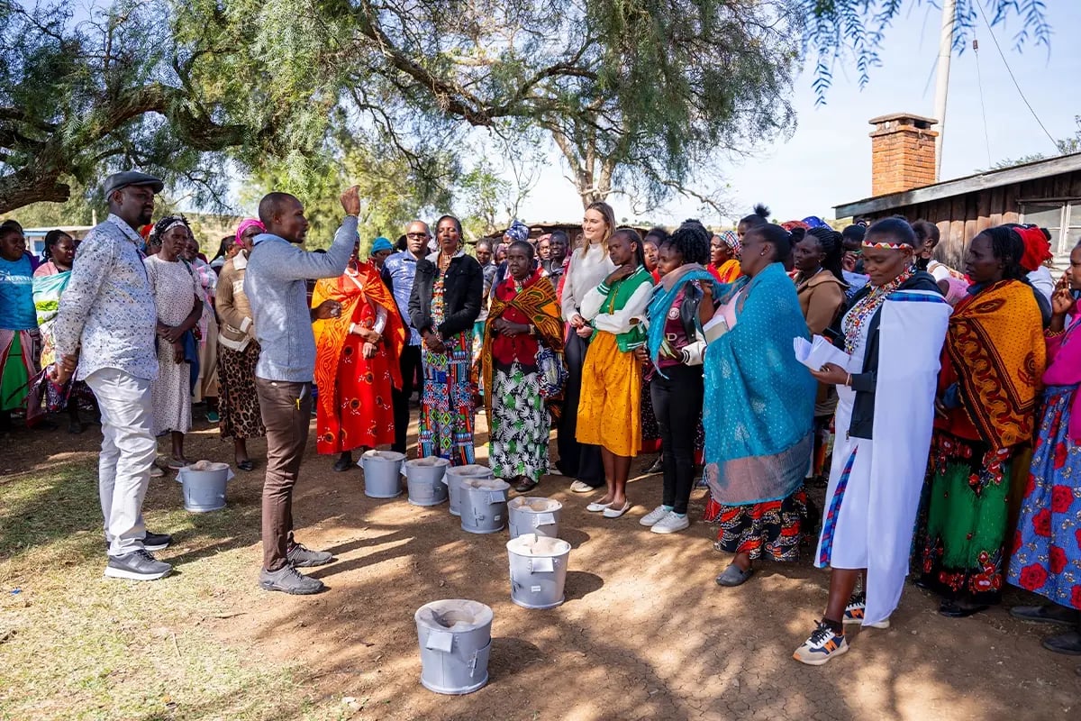 DGBs cookstove projects, How they truly make a difference_A DGB team member with the local community during cookstove training and distribution_visual 4