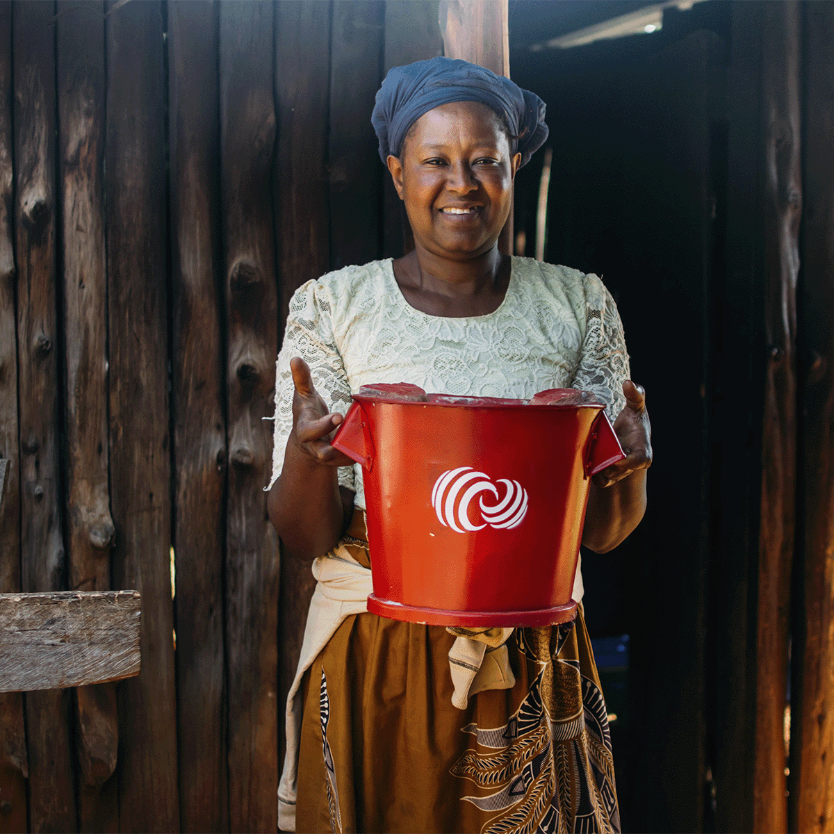 Hongera Energy Efficient Cookstoves Project_a local woman holding an energy-efficient cookstove