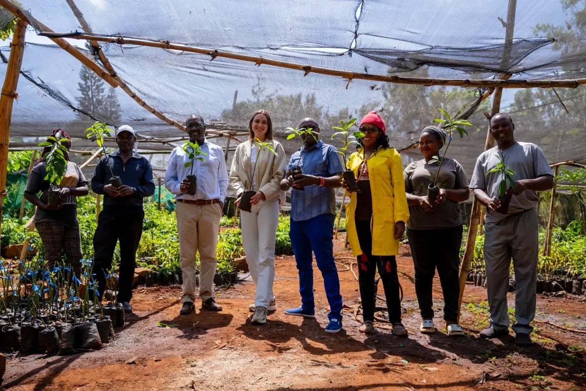 Local nurseries driving our reforestation in Kenya_DGB team members and members from a local community on a project site in Kenya_visual 4
