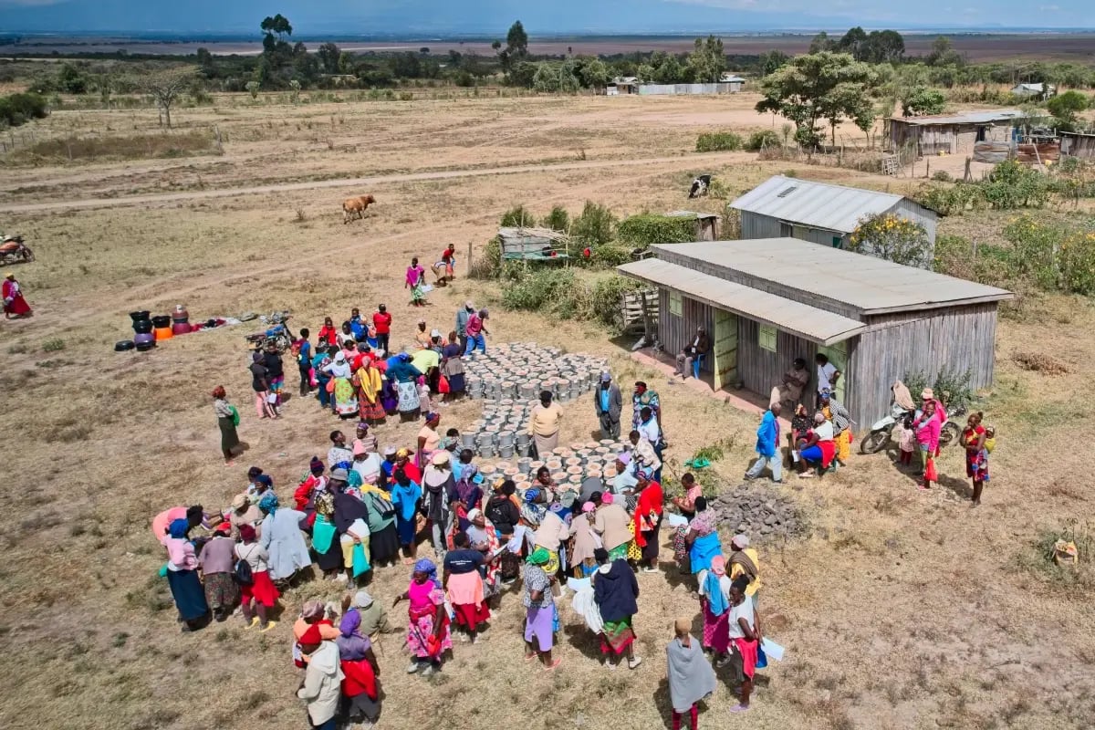 Local production, global purpose_a behind-the-scenes look at cookstove production_Aerial view of local community during cookstove distribution_visual 4