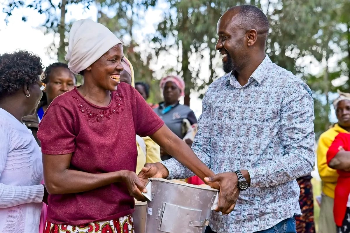Local production, global purpose_a behind-the-scenes look at cookstove production_Local woman receiving a cookstove from a DGB team member_visual 5