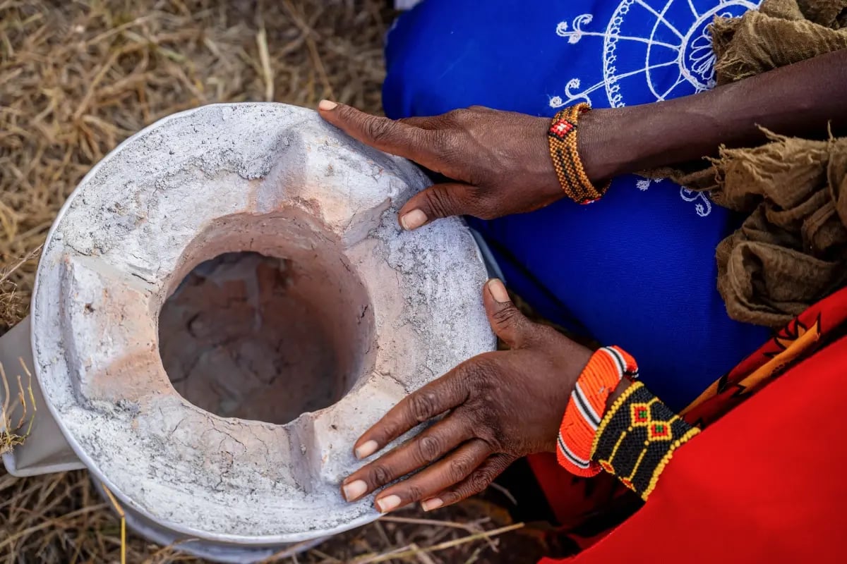 New stoves, new beginnings_ clean cooking for Maasai communities_Close-up of a Maasai woman holding her newly received cookstove_visual 3
