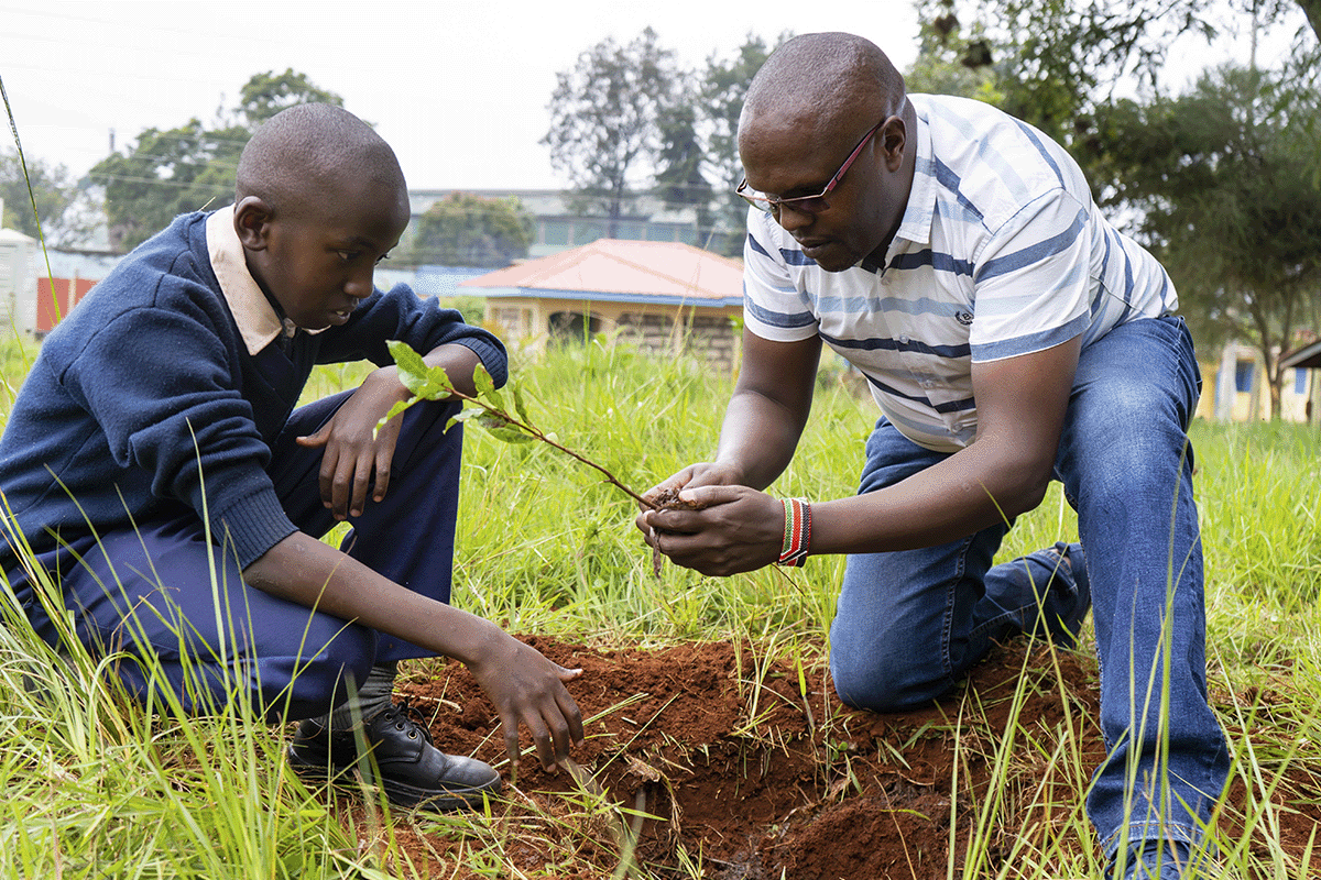 The rich tapestry of trees in DGB’s reforestation projects_DGB team member providing tree planting training with pupils from a local school_visual 8