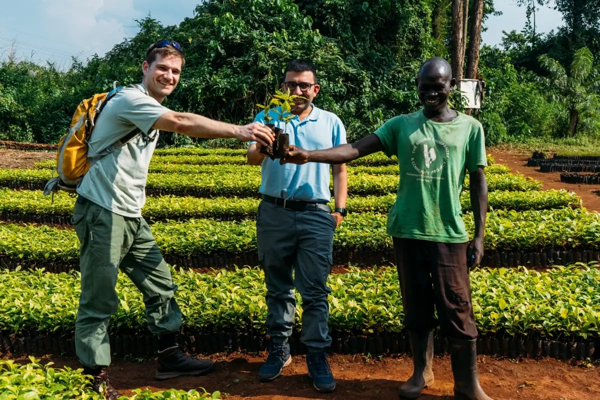 The social impact of our projects_DGB team members at a tree nursery in Uganda_visual 2