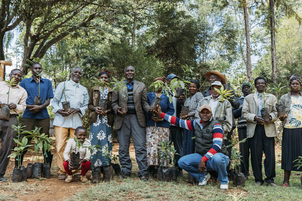 The team behind the Hongera projects’ impact_John during a tree planting with local people in Kenya_visual 5
