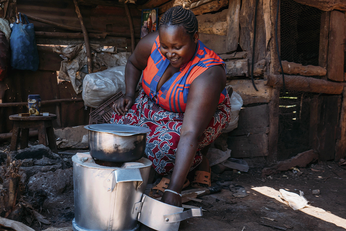 Unlocking carbon pricing_A local woman cooking on a energy efficient cookstove_visual 6