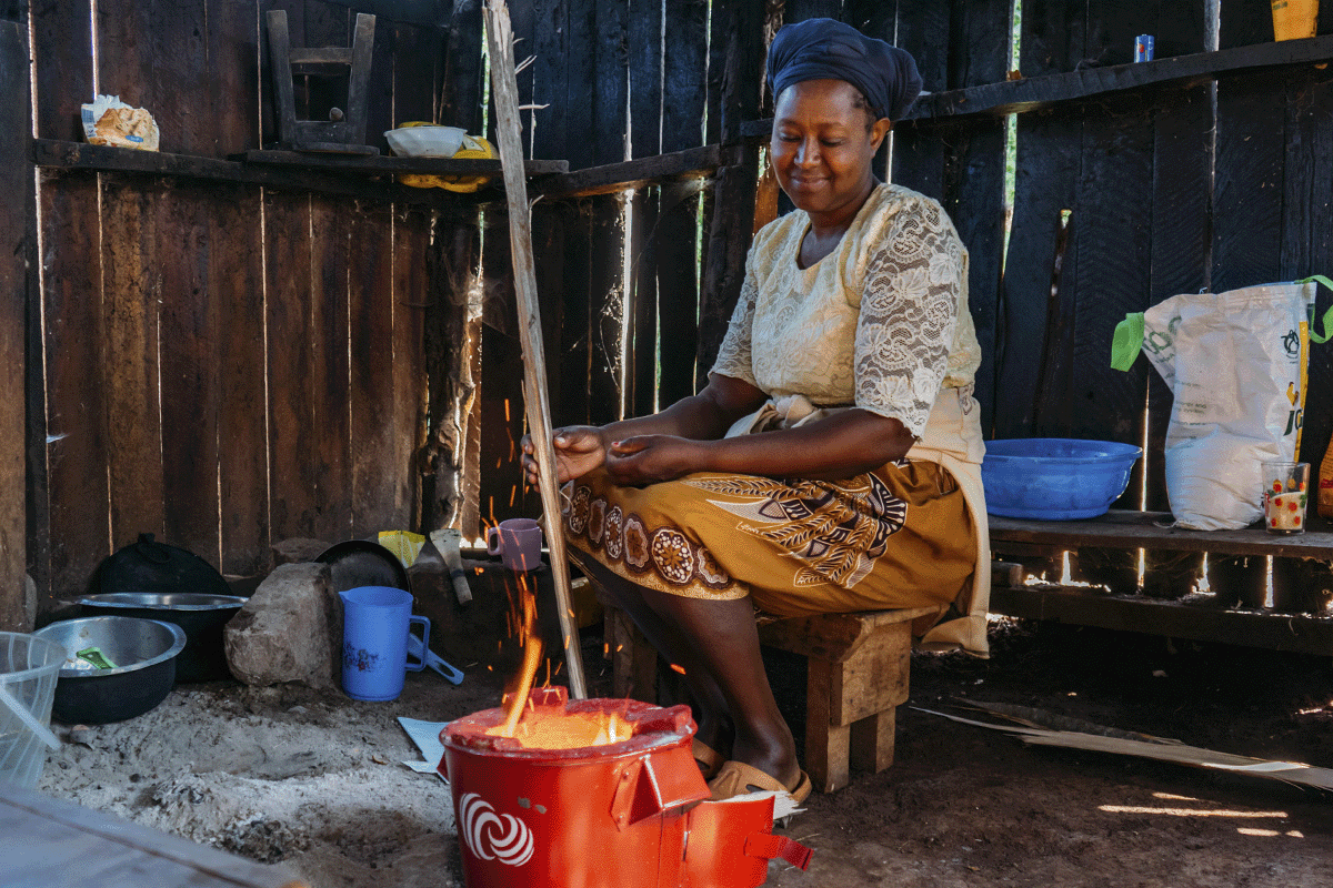 staying ahead of the curve on sustainability_woman cooking in an energy efficient cookstove_visual 2